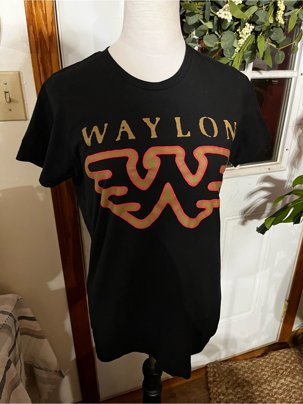 Black Short-Sleeve Graphic Tee with Gold Wordmark and Red Outline
